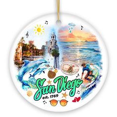 a round ornament with the words san diego on it and images of dolphins