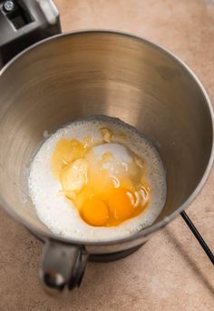 an egg yolk is in a bowl on the counter