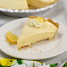 a slice of lemon pie on a white plate