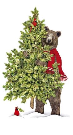 a brown bear standing next to a christmas tree with a red scarf on it's neck