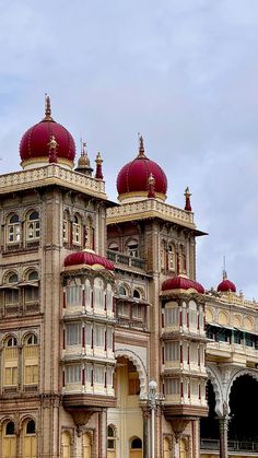 an ornate building with red domes on top