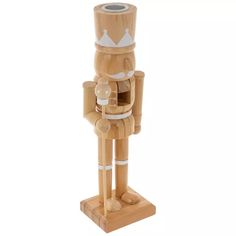 a wooden nutcracker with a crown on it's head is standing upright