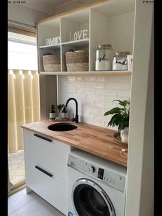 a washer and dryer in a small room