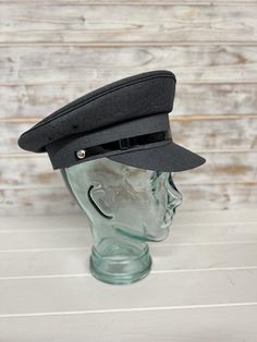 This is high quality professional Chauffeur Hat/Pilots Hat for that extra special finishing look for your driver. From the classic Roll's to a more modern car to a private jet,  the hats add the look and style to help you look the part. The hat is carefully made from Polyester with a black patent strap across the front Size 57cm Colour Grey with Black lining Classic Six-panel Formal Hat, Classic Six-panel Hat For Formal Occasions, Classic Formal Six-panel Hat, Classic Baseball Cap With Curved Brim, Classic Cap Hat, Classic Winter Baseball Cap, Classic Gray Cap, Formal Adjustable Six-panel Hat, Formal Fitted Six-panel Hat