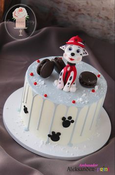 a cake decorated with a dog and cookies