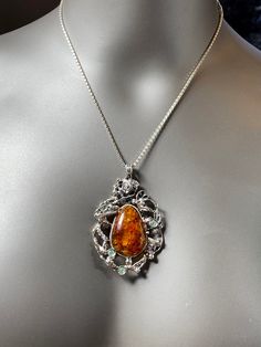 "ARTISAN AMBER PENDANT comes with 18\" chain Hand-made Sterling Silver 925. Stones used: Baltic Amber, Cubic Zirconia. Height -2 2/16\" (with bail), Width - 1 3/4\" Height - 67mm, width-40mm. Unique Handcrafted One-of a-kind Design Pendant. Each Piece of Jewelry in my Collection is One of a kind. When you start wearing a piece of my jewelry you will fall in love with it more and more each day and feel that good energy that I pass into it while creating this piece of Art. I use only natural uniqu Amber Necklace Hallmarked For Anniversary, Amber Hallmarked Necklace For Anniversary, Exquisite Pendant Necklaces, Elegant Amber Sterling Silver Necklace, Luxury Amber Necklaces For Anniversary, Luxury Amber Necklace For Anniversary, Artisan Hallmarked Necklaces For Anniversary, Artisan Crafted Necklace For Anniversary, Artisan Hallmarked Necklace For Anniversary