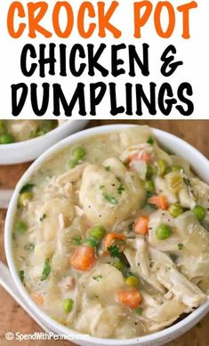 two bowls filled with chicken and dumplings on top of a wooden table next to carrots