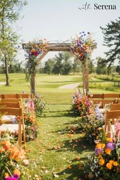 an outdoor ceremony with wooden chairs and flowers