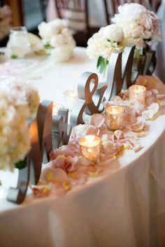 the table is decorated with candles and flowers