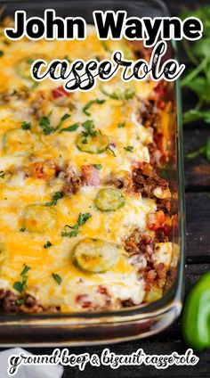 a casserole dish with meat, cheese and vegetables in it on a wooden table