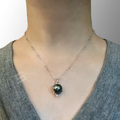 Cute and chic genuine Tahitian cultured pearl pendant necklace, pearl sized 11-12mm in peacock tone and mirror sheen, set in sterling silver globe bail, accent by silver made stars and moon, the accents are all pined in won't fall out, it's a healing piece by collecting the energy from planet and space, as perfect gift for Anniversary, Birthday, Engagement, Wedding, Mother's day, Valentine's day or just a reward for yourself. Quality: AA+ Color: Peacock tone Luster: Mirror sheen Nacre: Lustrous Tahitian Pearl Charm Jewelry, Tahitian Pearl Pendant Jewelry, White Gold Tahitian Pearl Necklace For Gift, Silver Tahitian Pearl Necklace With Pearl Drop, Luxury Tahitian Pearl Round Pendant Necklace, Silver Tahitian Pearl Necklace With Pearl Charm, Tahitian Pearl Charm Necklace With Round Pendant, Silver Tahitian Pearl Jewelry With Pearl Drop, Silver Tahitian Pearl Drop Jewelry