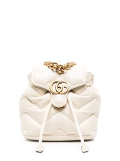 cream white calf leather smooth grain signature Marmont quilting signature Double G logo foldover top with magnetic fastening drawstring fastening single chain-link top handle two adjustable shoulder straps main compartment internal slip pocket debossed internal logo full lining gold-tone hardware This piece comes complete with a protective dust bag. Shop Gucci, Double G Logo, Hand Bags For Women, Quilted Backpack, Debossed Logo, Chain Top, G Logo, Women Leather Backpack, Gucci Gg Marmont