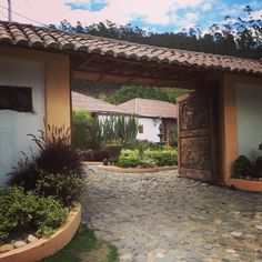 an entrance to a house with stone walkway