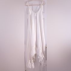 Long And Flowy With Ruffled Hem At Bottom. Nwt Ivory White Bohemian Sleeveless Sundress, Cream Sleeveless Sundress For Beach, Flowy White Sleeveless Dress For Vacation, White Sleeveless Ruffled Sundress, White Cotton Sleeveless Dress With Spaghetti Straps, White Sleeveless Cotton Dress With Spaghetti Straps, Cream Sleeveless Summer Maxi Dress, Cream Sleeveless Maxi Dress For Summer, Summer Sleeveless Cream Maxi Dress