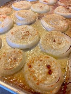 onions are being cooked in a pan on the stove top and ready to go into the oven