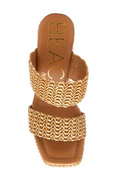 Wavy raffia textures this boosted sandal from the wide top straps to the chunky block heel and platform. Raffia upper/synthetic lining and sole Imported Vacation Wedge Sandals With Woven Sole And Block Heel, Block Heel Wedge Sandals With Woven Sole For Vacation, Trendy Straw Heels For Vacation, Straw Wedge Sandals With Block Heel For Beach, Beach Sandals With Platform And Block Heel, Beach Straw Wedge Sandals With Block Heel, Textured Sole Wedge Heels For The Beach, Beach Wedge Sandals With Textured Sole And Open Heel, Chic Beach Wedge Sandals With Stacked Heel