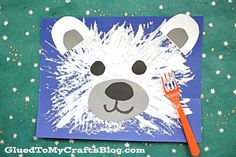 a polar bear craft with a fork on top of it