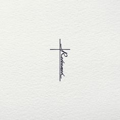 a cross with the word jesus written in cursive writing