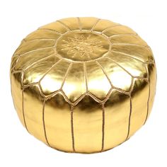 a gold leather poufle on a white background