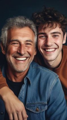 two men smiling and posing for the camera with their arms around each other's shoulders