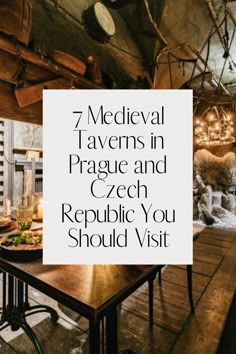 a table with a sign that says 7 medieval taverns in prague and czech republic you should visit