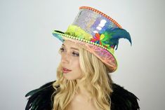 Want something that no one else has? Looking for EXACTLY what you want? You’ve come to the right place for bespoke top hats! We specialize in making truly unique festival hats and sequined headdresses for special occasions. :) FEATURES: All hats come with LED Lights Each sequin is glued by hand with industrial grade adhesives. Our hats are often imitated but the durability is NEVER duplicated. This hat is built to last and party as hard as you do! HOW IT WORKS:Anything is possible - Let us know Disco Ball Helmet, Holographic Jacket, Light Up Hats, Rave Hats, Festival Hats, Rave Mask, Steampunk Hat, Custom Top, Rave Bra