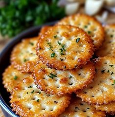 small crackers with parsley in a blue bowl