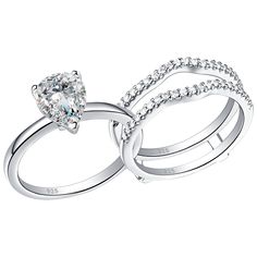 two white gold wedding rings with diamonds on each band and an oval shaped diamond in the middle