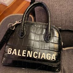 Practically New Authentic Extra Small Balenciaga Bag. Only Worn A Couple Of Times. Has Long Strap For Cross Body Option. Black With White Lettering. Balenciaga Bag, Cross Body, A Couple, Balenciaga, Bag Lady, Black White, Black And White, White, Black