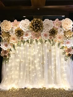 the backdrop is decorated with flowers and lights