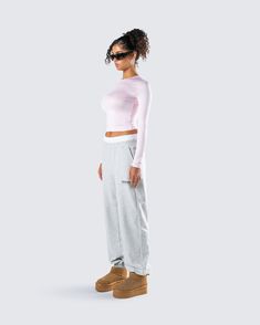 Even on your off days, you’ll look better than everyone in this two-piece set 💗 Perfect for your casual days, this fit features a pink jersey long sleeve top paired with grey sweatpants, for a look that blends cute and cozy in the best way possible 😚 Pink Athleisure Sweatpants For Lounging, Trendy Pink Sweatpants For Lounging, Pink Athleisure Activewear For Lounging, Pink Sweatpants For Fall Loungewear, Fall Pink Sweatpants For Loungewear, Sporty Pink Sweatpants With Ribbed Cuffs, Pink Athleisure Sweatpants With Ribbed Cuffs, Pink Casual Sweats For Loungewear, Casual Pink Sweats For Loungewear