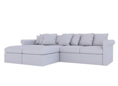 a white sectional couch with pillows on it's back and bottom part facing the camera