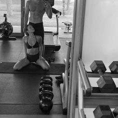 a man and woman doing exercises in a gym