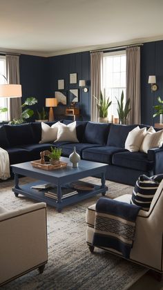 a living room filled with blue couches and white pillows on top of a rug