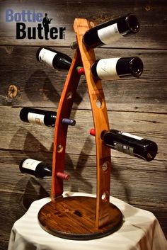 a wine rack made out of wood with bottles on it