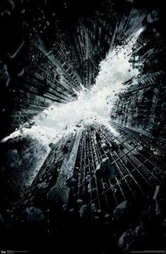 the dark knight rises movie poster with batman's face in the middle of it