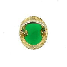 "VINTAGE BIG OVAL FAUX CHRYSOPRASE STATEMENT COCKTAIL GOLD TONE RING SZ 5-7 ADJ. Offered here is a vintage big oval faux chrysoprase gold tone ring size in an adjustable size from, a 5 to a 7. The bezel set chrysoprase stone measures 1\" x 3/4\", with a 18\" gold tone, rope design border. This piece is not marked or signed. In very good vintage condition. Note-the green color in person is darker, more like real Chrysoprase! Please see our original photographs and use them as an extension of our Vintage Green Opal Round Ring, Vintage Green Opal Ring For Anniversary, Vintage Green Opal Ring, Vintage Green Oval Opal Ring, Elegant Oval Chrysoprase Rings, Vintage Oval Jade Emerald Ring, Vintage Oval Jade Rings, Green Oval Cabochon Emerald Ring Collectible, Antique Green Oval Cabochon Ring