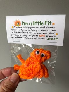 an orange stuffed animal in a plastic bag that says i'm a little fit