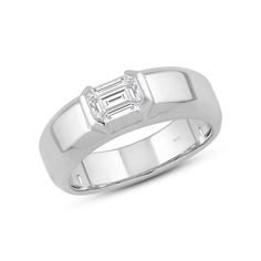 a white gold ring with a baguette cut diamond set in the center and sides