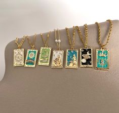 Gold Enamel Tarot Necklace This item is nickel-free, and lead-free. This item is made of high-quality materials and it will NOT tarnish nor discolor for a long time. P R O D U C T D E T A I L S Pendant Material: 18K Gold Plated Brass Pendant Size: 1.5 x 2.5 cm Chain Materials: Lip Chain: Gold Plated over Stainless Steel (Width: 1.7mm) Twist Chain: Gold Filled (Width: 1.7mm) Dainty Chain: Gold Filled (Width: 1.5mm) Figaro Chain: Gold Filled over Stainless Steel (Width: 3 mm) Beaded Chain: Gold Plated over Stainless Steel (Width: 1.8mm) Flat Curb Chain: Gold Plated over Stainless Steel (Width: 1.5mm) Link (Paperclip) Chain: Gold Plated over Stainless Steel (Width: 4 mm) Small Curb Chain: Gold Plated over Stainless Steel (Width: 3 mm) Big Curb Chain: Gold Plated over Stainless Steel (Width: 6 Luxury Engraved Jewelry For Festivals, Zodiac Stamped Jewelry, Cheap Star Charm Necklace For Gift, Luxury Celestial Necklaces For Gifts, Luxury Celestial Engraved Jewelry, Cheap Star Charm Necklace Gift, Sun Knight, Tarot Necklace, Knight Of Cups