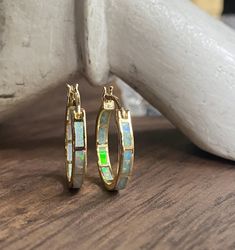 "The perfect hoops for everyone, everyday, all day! These comfortable little beauties will take you from day to night and look great dressed down but fit in to formal events with ease. Super fiery opals are inlaid into these darling little 14k gold plated classic hoops. Hoops measure 20 mm and are 3mm thick. In inches these are about 3/4\" hoops. *Perfect for bridesmaids *These arrive ready for gifting in a cute, boho gift box *Usually ships same day or next *Free shipping on all domestic orders Gold Opal Hoop Jewelry, Gold Hoop Opal Jewelry, Small Hoop Opal Earrings For Gift, Opal Hoop Earrings As A Gift, Gold Opal Small Hoop Earrings, Small Gold Hoop Earrings With Opal, Gemstone Hoop Earrings For Anniversary, Gemstone Hoop Earrings, Tourmaline Earrings