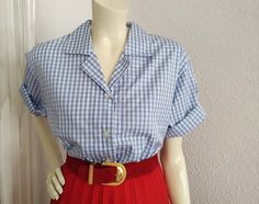 Vintage from the 1990s Materials: cotton gingham blouse 90s gingham blouse, minimalist summer blouse, notched collar, preppy blouse, button up shirt, checkered blouse, cotton plaid blue blouse. Measurements laying flat : shoulders :44cm (17,5 inches) bust:54 cm (21 inches) total lenght :59 cm (23 inches) sleeve lenght :26 cm (10,5 inches) Cheap Gingham Shirt With Button Closure, Preppy Collared Shirt For Summer, Preppy Gingham Shirt For Summer, Summer Preppy Gingham Shirt, Gingham Button-up Blouse For Work, Summer Plaid Button-up Blouse, Gingham Collared Blouse For Work, Summer Gingham Blouse For Workwear, Summer Workwear Gingham Blouse