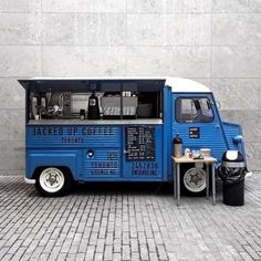 an ice cream truck parked in front of a building