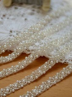 several strands of white pearls on a table