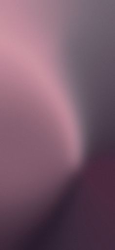 a blurry image of the back side of a pink and purple wallpaper with an abstract design