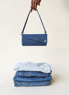 Embrace the spirit of summer with Denim Cerène, a chic handbag that combines the classic appeal of denim with modern sophistication. This deep blue denim bag is the perfect accessory for those who love to blend casual comfort with high-end style. The Denim Cerène is versatile enough to take you from a day at the beach to an evening out, offering a laid-back yet polished look that complements any summer outfit. #denimbag #barrelbag #blackownedbusiness #handbags Denim Handbag, Barrel Bag, Denim Bag, Chic Handbags, Summer 24, Denim Fabric, Polished Look, Deep Blue, Summer Outfit