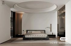 a large white bed sitting in a bedroom under a circular light