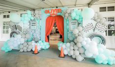 an entrance decorated with balloons and streamers