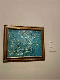 a painting hanging on the wall in an art gallery