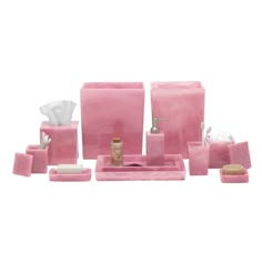 pink bathroom accessories set on white background